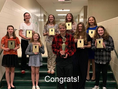 Image of JVSD speech team holding awards for first place